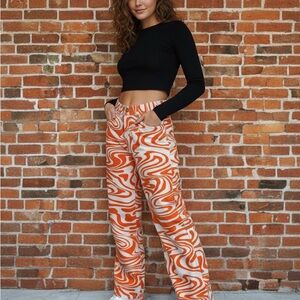 Black Crop Top and Orange Swirl Pants